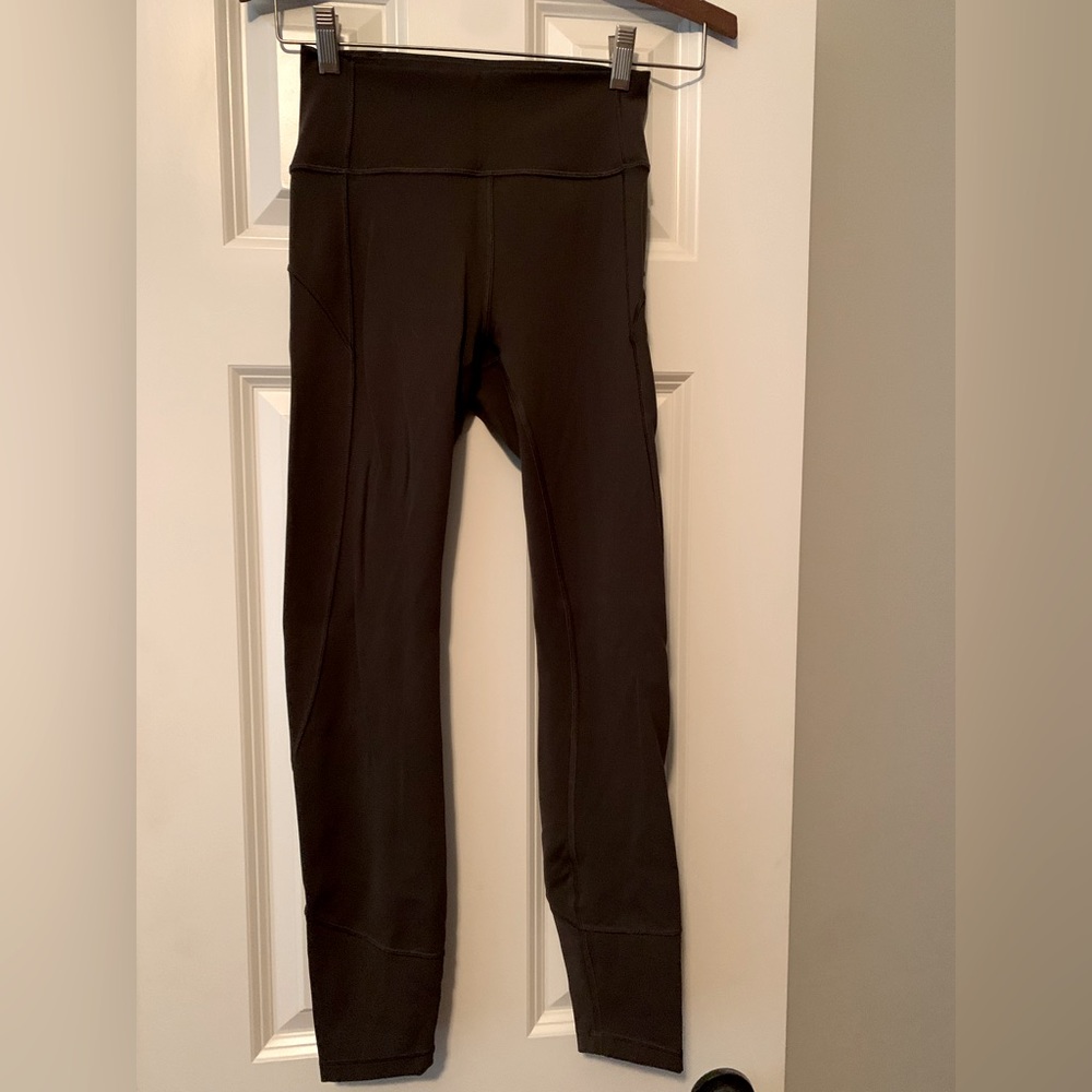 Lululemon Dark Olive “In Movement” 25” leggings size 4